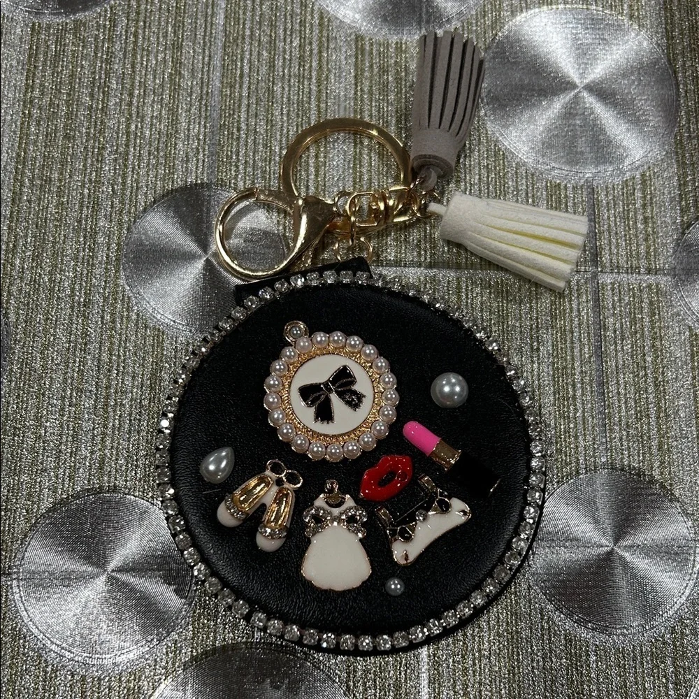 Black and‎ Gold Compact Mirror Keychain with Charm Embellishments.